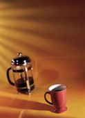 coffee - a coffee press and a cup of coffee
