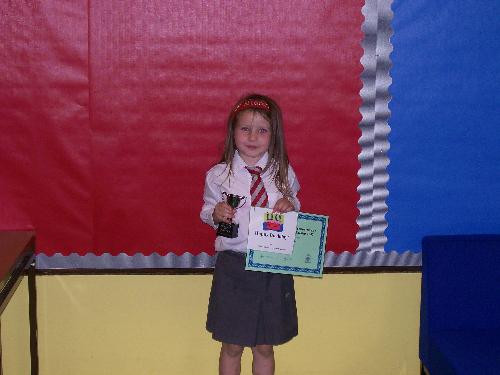 Niamh with excellence award - Naimh in P1 with her excellence award