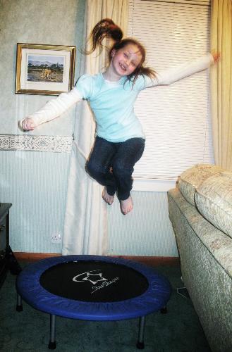 Niamh on trampoline - Niamh minutes after having a tooth knocked out! lol