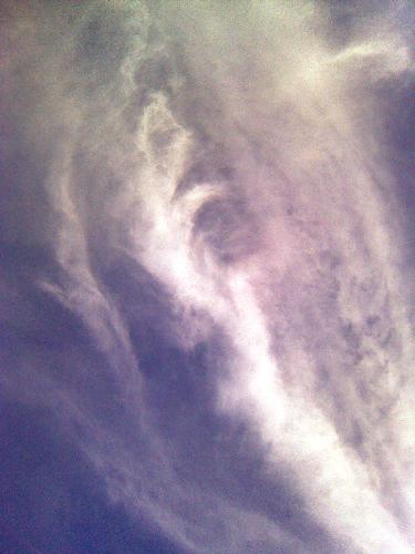 cloud formation - a lady with long hair seemed descending or watching over creations on the earth