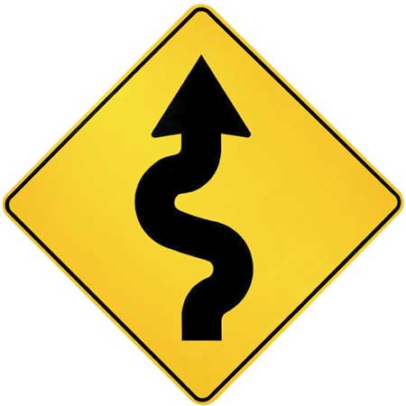 A street sign - curvy road ahead - a typical street sign you might see in day to day driving