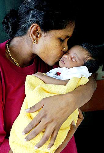 Mom - This photo tells that how mom cares her baby.