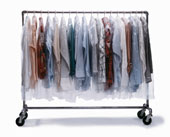 Clothes - Dry-cleaned clothes wrapped in plastic hanging on clothes rack