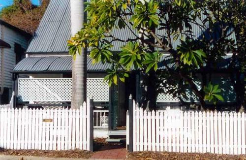 House with a tree... - and a really nice white picket fence.