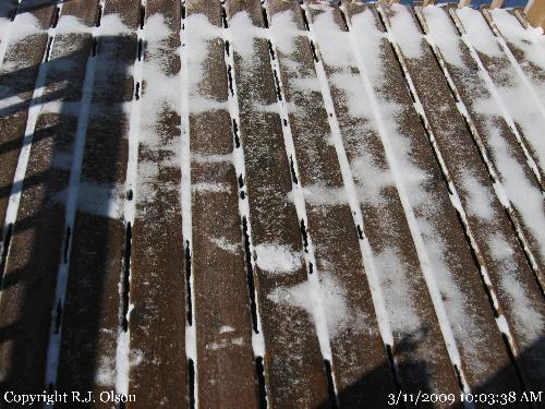 Ice and snow - My front deck is covered with a thin layer of snow with ice underneath. Ice and snow - My front deck is covered with a thin layer of snow with ice underneath.