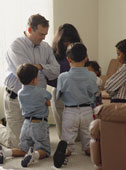 Family Prayer - a christian family gathers in a circle for family prayer