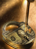 money - Key and lock with US Dollar bill imprinted on it