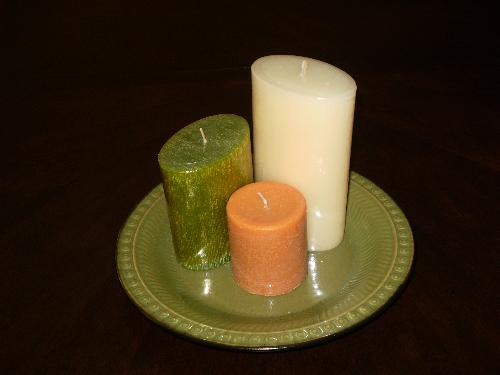 Candles - Grouping candles in various colors, shapes, and sizes on a platter.