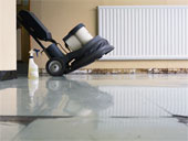 Cleaning - Floor Cleaning Machine and Bottle of Cleaner