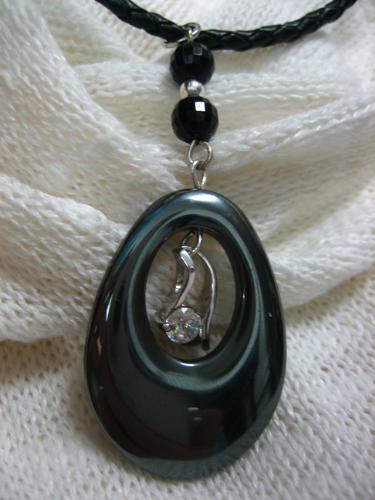 Oval Black Ore Necklace - This necklace is made with a black ore on a plaited black leather cord.