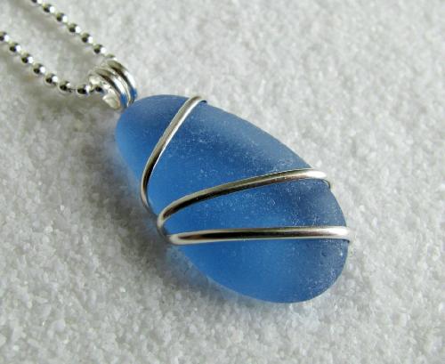 Cornflower Blue Sea Glass Necklace - A gorgeous cornflower blue piece of sea glass hangs from an 18" sterling silver chain. The sea glass has been wrapped with sterling silver wire.