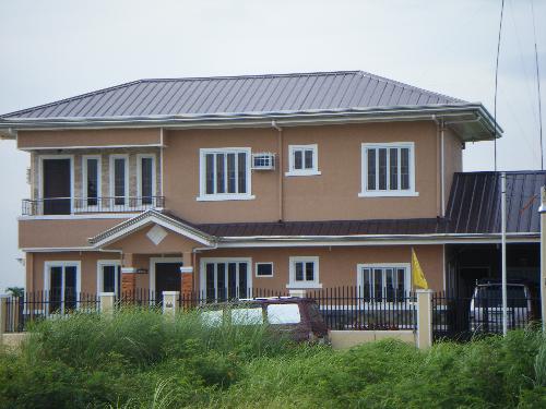 brown house - one of the houses in a subdivision. it looks nice