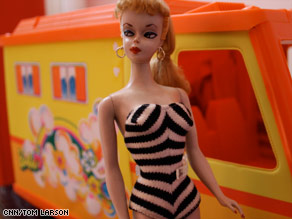 Barbie from 1959 - This is a photo of a barbie doll from 1959 standing beside her barbie van.