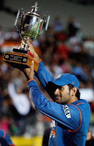 Dhoni - Mahendra Singh Dhoni lifting the trophy :)