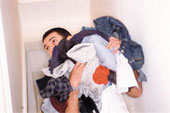 Laundry - Man with dirty laundry