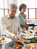 Dining - Guests dining at a hotel restaurant buffet.