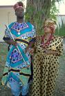 African Costumes - A photo of two africans in traditional dress.