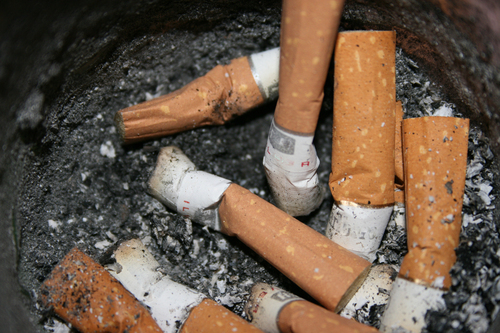 cigarettes - ashtray full of used cigarettes.