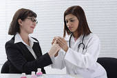 Doctor - Doctor applying bandage to patient s finger
