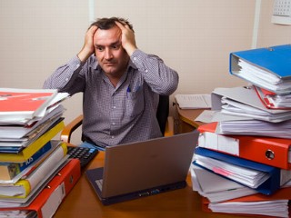 stress - a man stressed in his work.