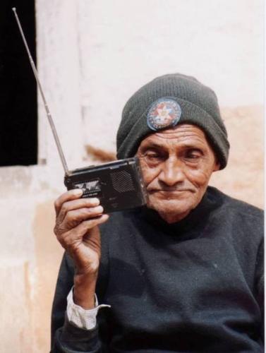 radio - an old man listening to his radio.