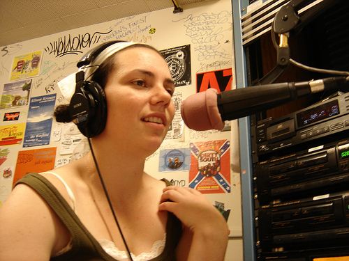 dj - a female DJ doing her job.