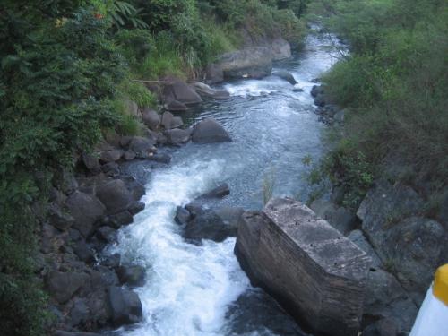 blue river at Bukidnon - This is a photo taken on our way to Davao City via Bukidnon province... This is a tourist spot but partially developed. If you could get really close to the river, you can see at the left side of it that a blue water is gushing out from a small cave. This is the reason why people here are fascinated by the river...