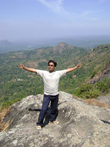 height matters - its the place in kerala,INDIA in WAYANAD district. Its the Edakkal caves and the cliff where i am standing is 400ft above the sea level so to reach there was very adventurous . i have to cross so many difficulties to stand there . So, i thought to share it with you members