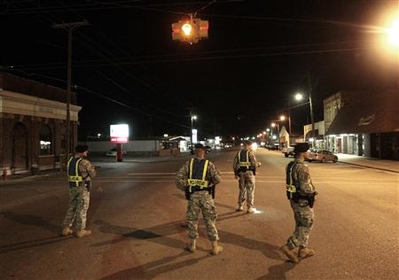 Soldiers patrol alabama - Soldiers from Rt. Rucker patrol the streets of alabam in the aftermath of latweeks shooting