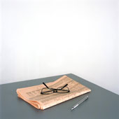 Reading - reading glasses on top of a newspaper