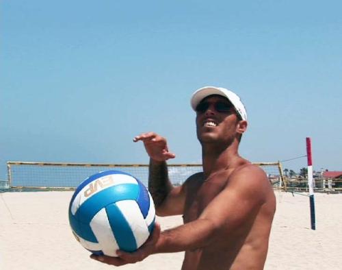 serve - a man about to serve the ball.