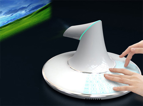 B-Membrane laptop 2009 Gadget world - Cocept computer designed by korean desiger Won-Seo Lee. No monitor, judt a UFO shape system that displays screen like a projector. he has taken the need for the equation and opted for beaming your youTubing onto any surface you can point the omni-directional projetor at. Some highlights of this kubrick inspired mother ship computer include a membrane keybord that appers when needed, the projector can beam ambient light effects on any surface you desire .