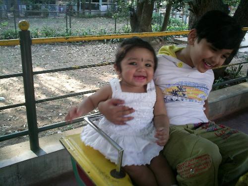 My son & my daughter - This photo was taken when they were having a whale of a time on one of the rides in Cubbon park in Bangalore.