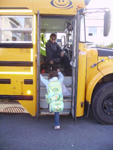 on the bus - my daughter getting on the school bus