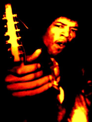 Jimi and his Guitar - Legendary guitar god, Jimi Hendrix tuning his guitar.