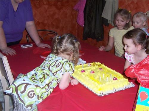 my girls' birthday party - my girls blowing out their candles.