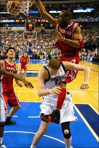 Tracy Mcgrady dunk over Shawn Bradley - This is one of the best dunks I have ever seen, especially in a real game not in the slam-dunk contest.
