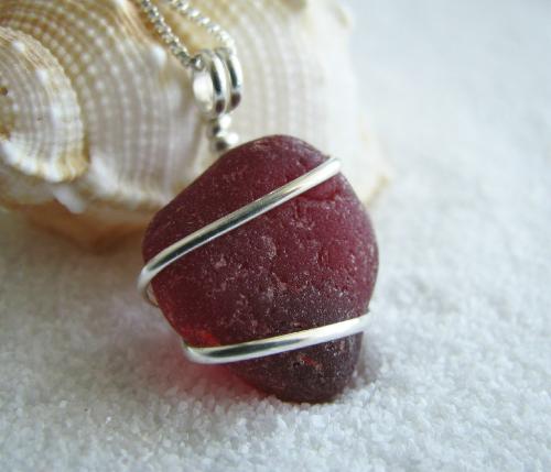 Cranberry Red Sea Glass Necklace - This is only my 2nd sea glass creation using a piece of red sea glass. This chunky piece was found in Puerto Rico and measures approx 3/4' in length and is about 1/4' thick. Wrapped in sterling silver wire, the pendant hangs on an 18' sterling silver Venetian style chain. Red sea glass is an extremely rare color and is probably the most sough after colors. The approx odds of finding a piece of authentic red sea glass is 1 in every 5,000 pieces found.