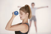 woman - Woman lifting weight, woman stretching in background