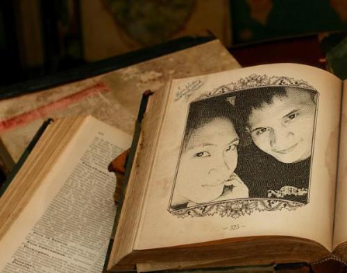 bf and gf - this a photo of me and my boyfriend.. i really love the effects a got from photofunia, it makes my pictures more special.. this effects make us look we are couple from the past, coz the books look old but sturdy!!