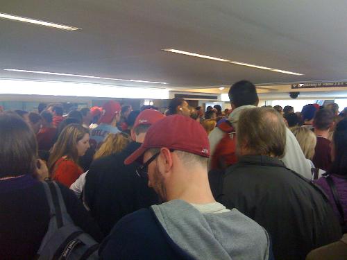 Waiting in line to get on the train after the phil - This was sooooooo boring. I had to wait on line forever just to get on a train to see my girlfriend in college. All I saw was red hats every where