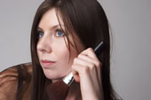 model - Model holding makeup brush