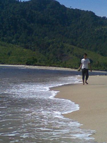 On the seashore - It's me walking on the seashore. The picture is taken by my friend using my camera phone