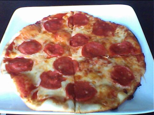 peperoni pizza - this is joey's peperoni pizza, a local pizza place bear our office. its so delicious and yummy!! it is thin crust so you will surely enjoy the pizza flavor.