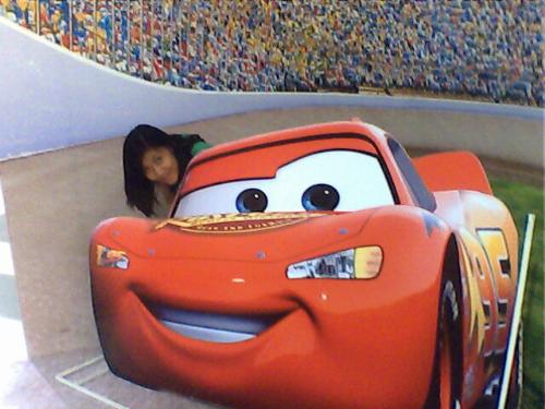 me and lightning mcqueen - this is me and the photo stand of lightning mcqueen at the mall. its the mall trat for kids last christmas. kid can have their photo taken with their favorite catoon character like this one! it not only for kids but also for kids at heart!