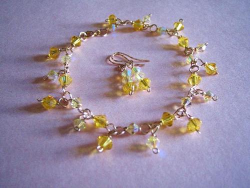 ss1 - An elegant swarovski yellow color bracelet and earrings