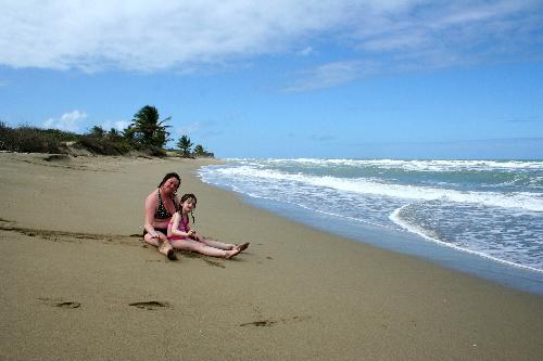 Donna & Hollie - relax on the beach after boogie boarding.