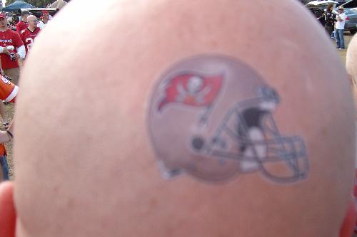 True Fan Tattoo - My friend put a temporary tattoo of the Tampa Bay Buccaneers on his head. We are hard core fans. Maybe one day he will get a permanent one on his bald head...LOL.