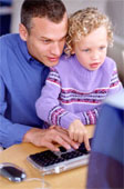 Computer - Father and daughter at computer