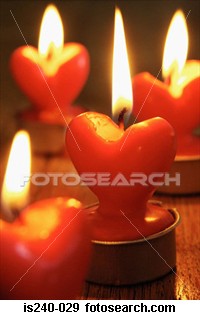 candle - This is a picture of heart shaped candles. I wish I had some of these pretty red candles. They would look good burning in my house just like in the picture.